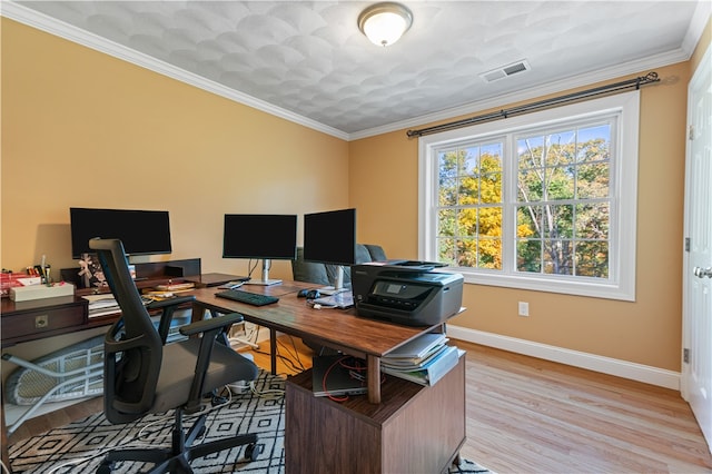 office area with crown molding and light hardwood / wood-style floors