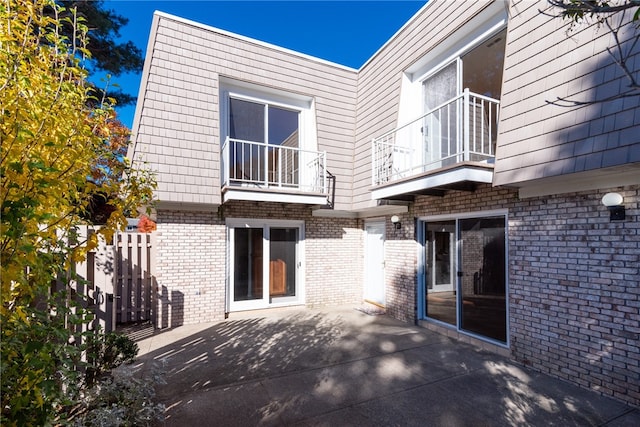 exterior space with a patio area and a balcony