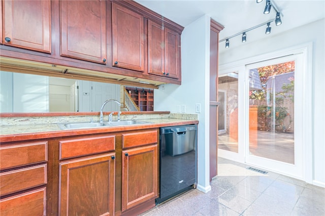 kitchen featuring black dishwasher, sink, and track lighting