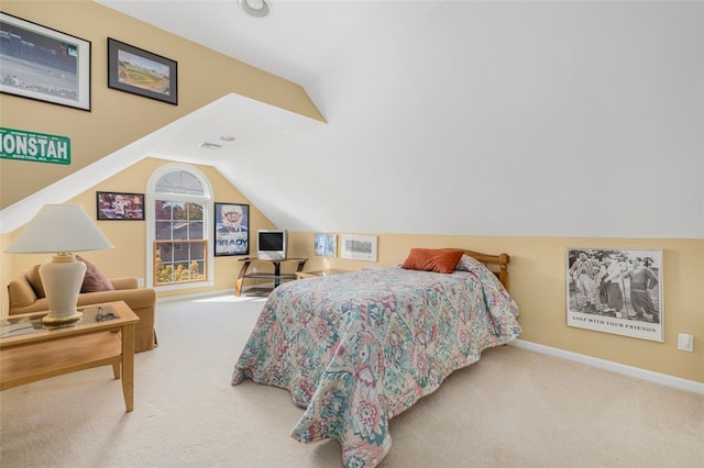 carpeted bedroom featuring lofted ceiling