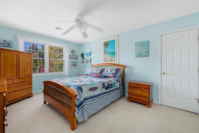 bedroom with light carpet and ceiling fan