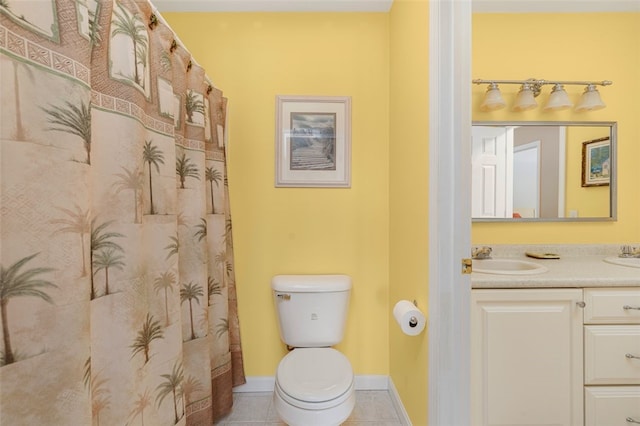 bathroom with vanity, tile patterned floors, and toilet