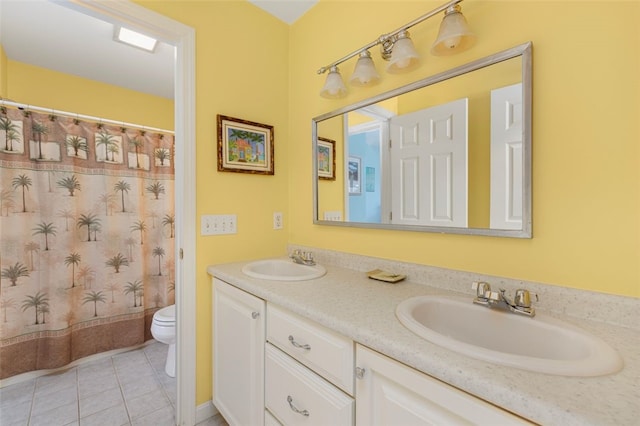 bathroom with vanity, walk in shower, tile patterned flooring, and toilet