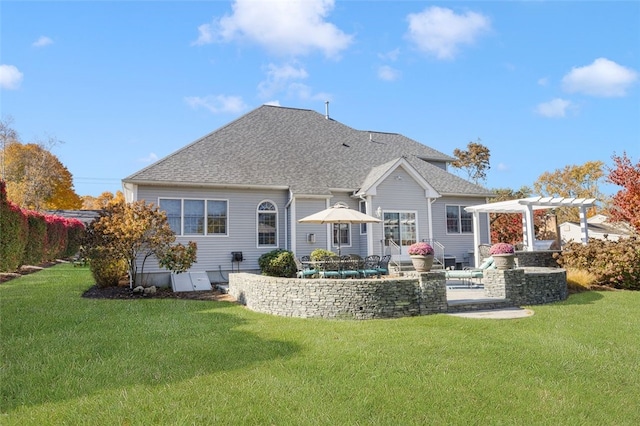 back of house featuring a yard, a pergola, and a patio area