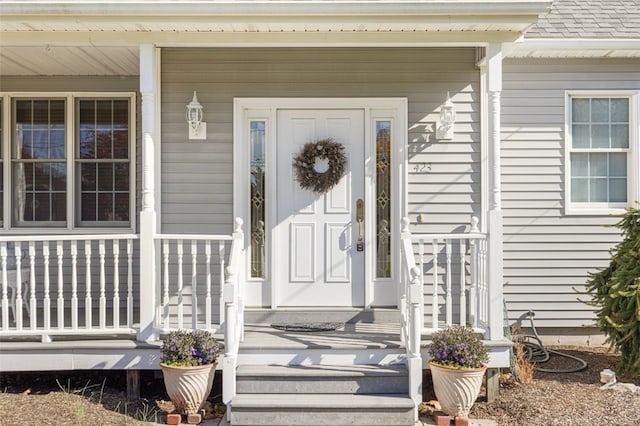 doorway to property with covered porch