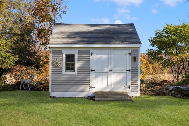 view of outdoor structure with a lawn