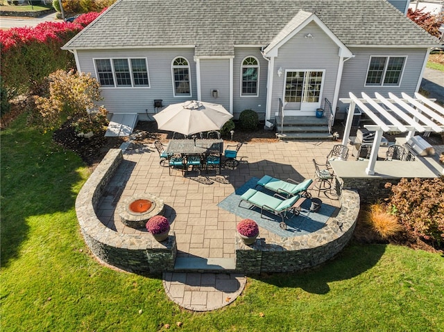 back of house with a yard and a patio area