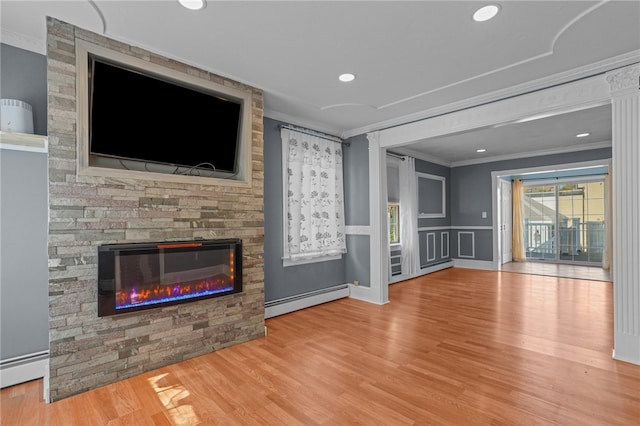 unfurnished living room with light hardwood / wood-style floors, a baseboard heating unit, a stone fireplace, and ornamental molding