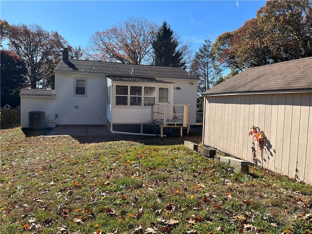 rear view of house with a yard, a patio, and cooling unit