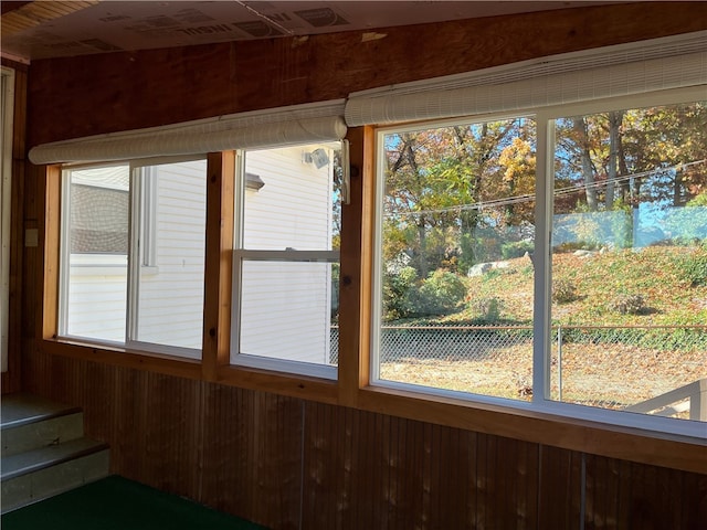 unfurnished sunroom with a wealth of natural light