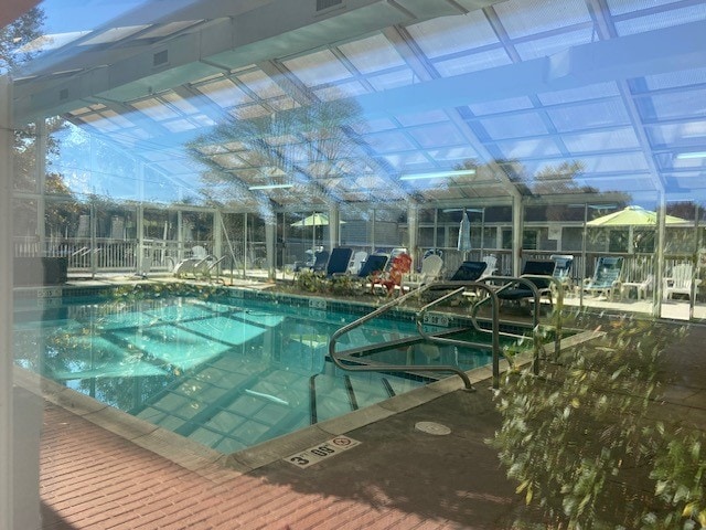 view of pool with a lanai