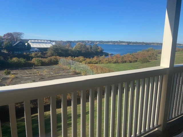 balcony featuring a water view