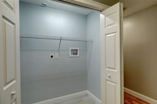 clothes washing area featuring electric dryer hookup, washer hookup, and wood-type flooring