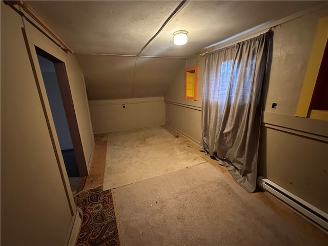 bonus room with lofted ceiling and a baseboard radiator