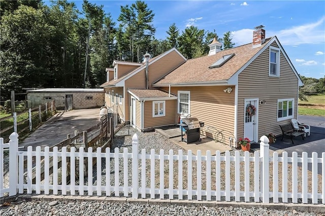 rear view of house with a patio