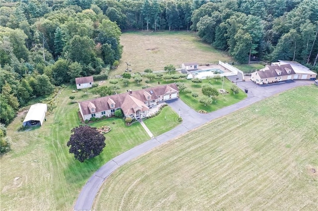 birds eye view of property with a rural view