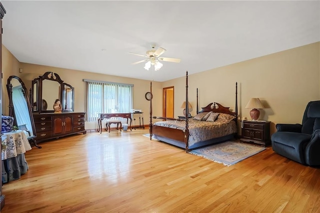 bedroom with light hardwood / wood-style flooring and ceiling fan