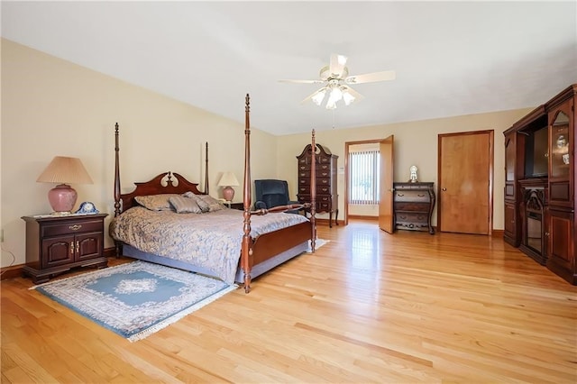 bedroom with light wood-type flooring and ceiling fan