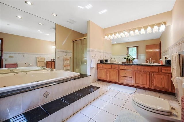 full bathroom with vanity, independent shower and bath, toilet, and tile patterned flooring