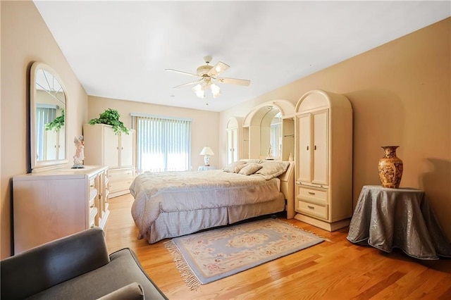 bedroom featuring light hardwood / wood-style floors and ceiling fan