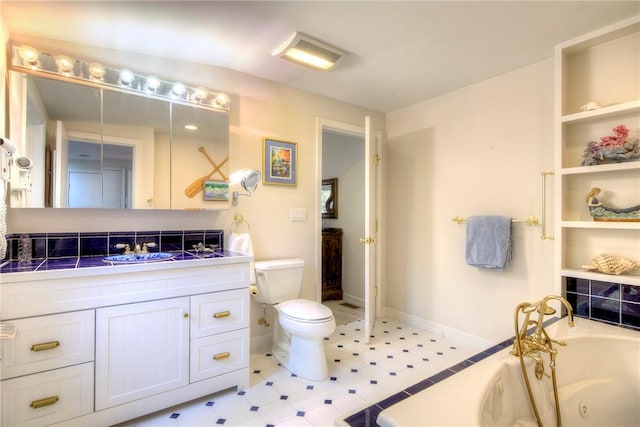 bathroom with toilet, a tub, and vanity