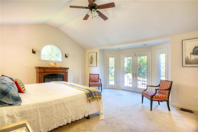 bedroom with access to outside, french doors, light carpet, ceiling fan, and multiple windows