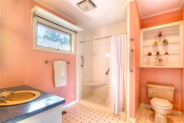 bathroom featuring a shower with shower curtain, crown molding, vanity, and toilet