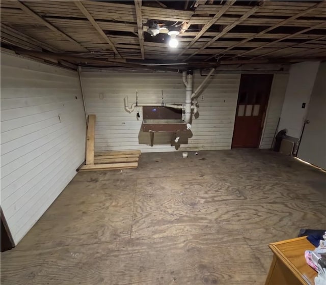 basement with wooden walls