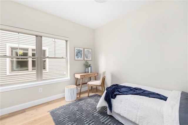 bedroom with wood-type flooring