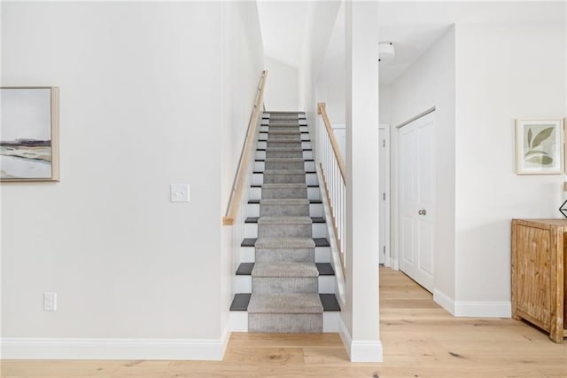 stairs with hardwood / wood-style floors