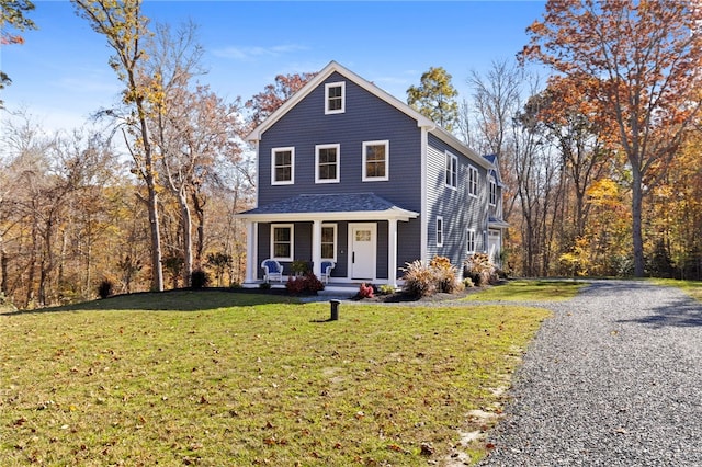 front of property featuring a porch and a front lawn