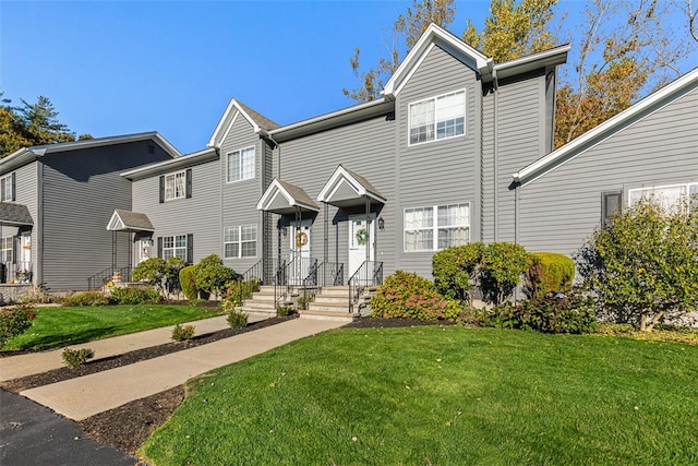 view of front of home with a front lawn