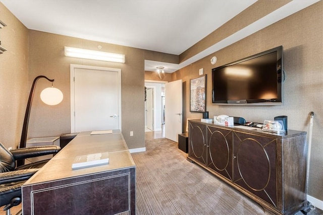 office featuring baseboards and light wood-style flooring