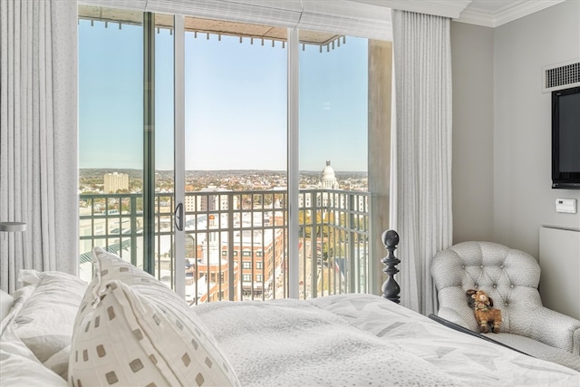 bedroom with crown molding and multiple windows