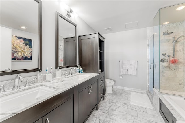 full bathroom featuring vanity, shower with separate bathtub, and toilet