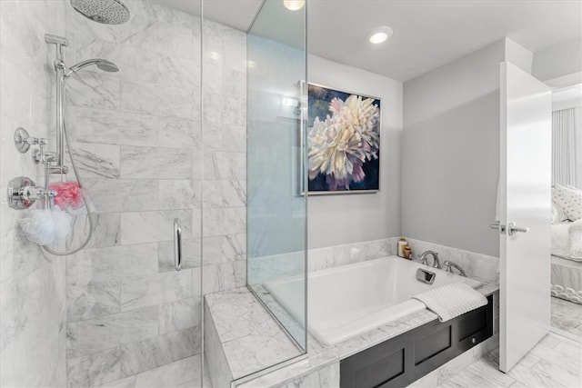 full bathroom featuring connected bathroom, marble finish floor, a shower stall, and a garden tub