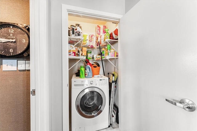 clothes washing area featuring laundry area and washer / dryer