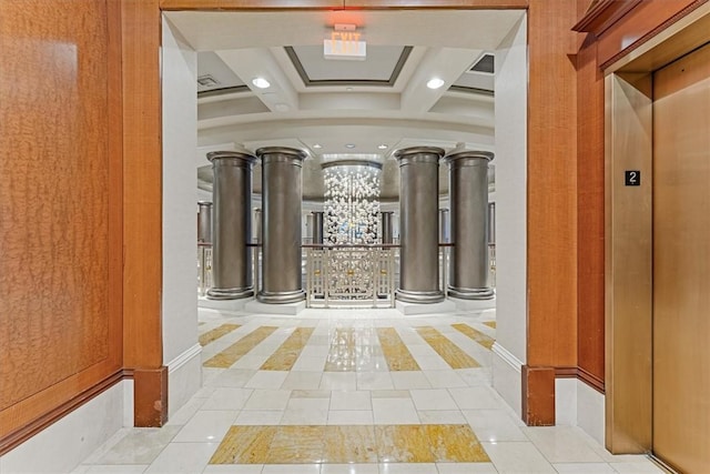 corridor featuring recessed lighting, tile patterned floors, decorative columns, and elevator