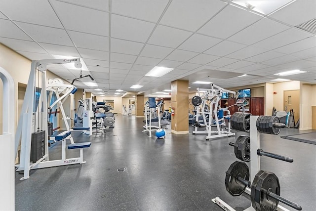 gym with visible vents and a drop ceiling