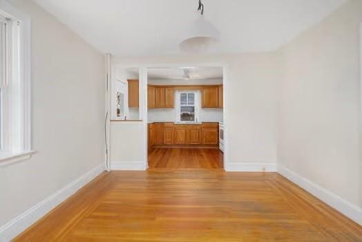 unfurnished living room featuring light hardwood / wood-style floors