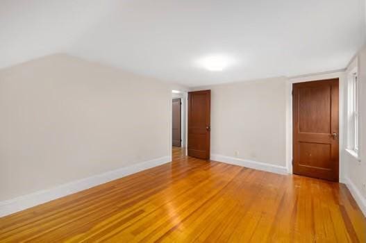 unfurnished room featuring hardwood / wood-style flooring