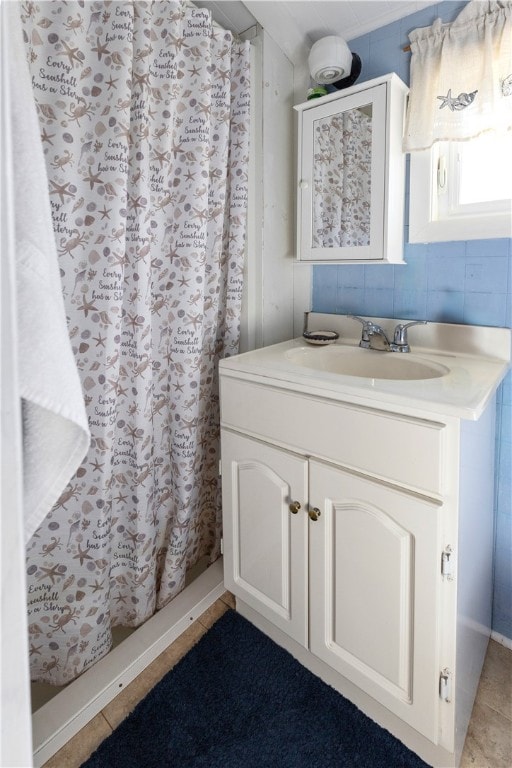 bathroom featuring vanity, a shower with curtain, and tile patterned flooring