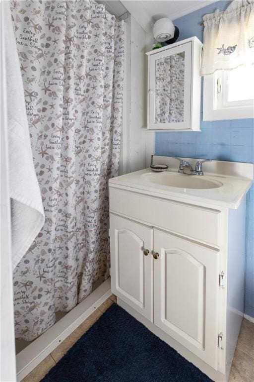 bathroom with vanity and curtained shower