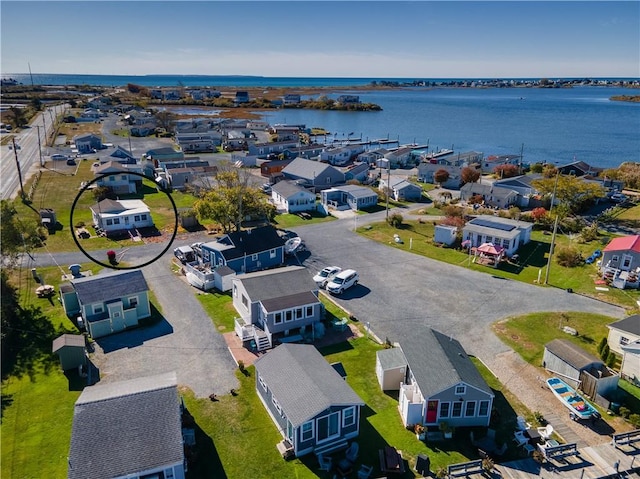 birds eye view of property featuring a residential view and a water view