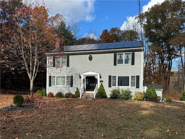 colonial house with solar panels