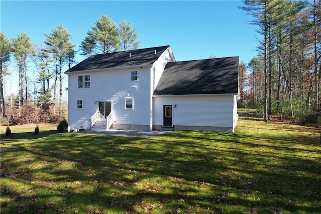 back of house featuring a yard