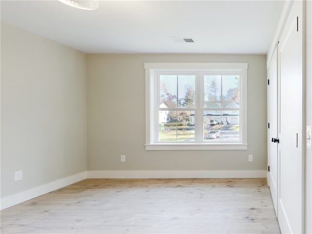 empty room with light wood-type flooring