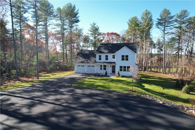 view of front facade with a front lawn and a garage