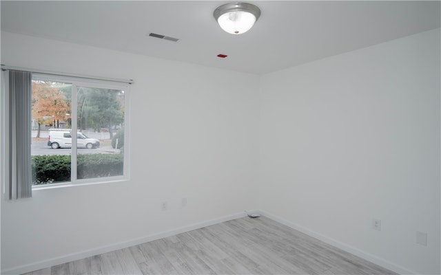 empty room with light hardwood / wood-style floors