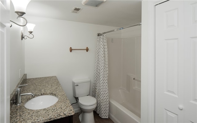 full bathroom with vanity, toilet, tile patterned floors, and shower / tub combo